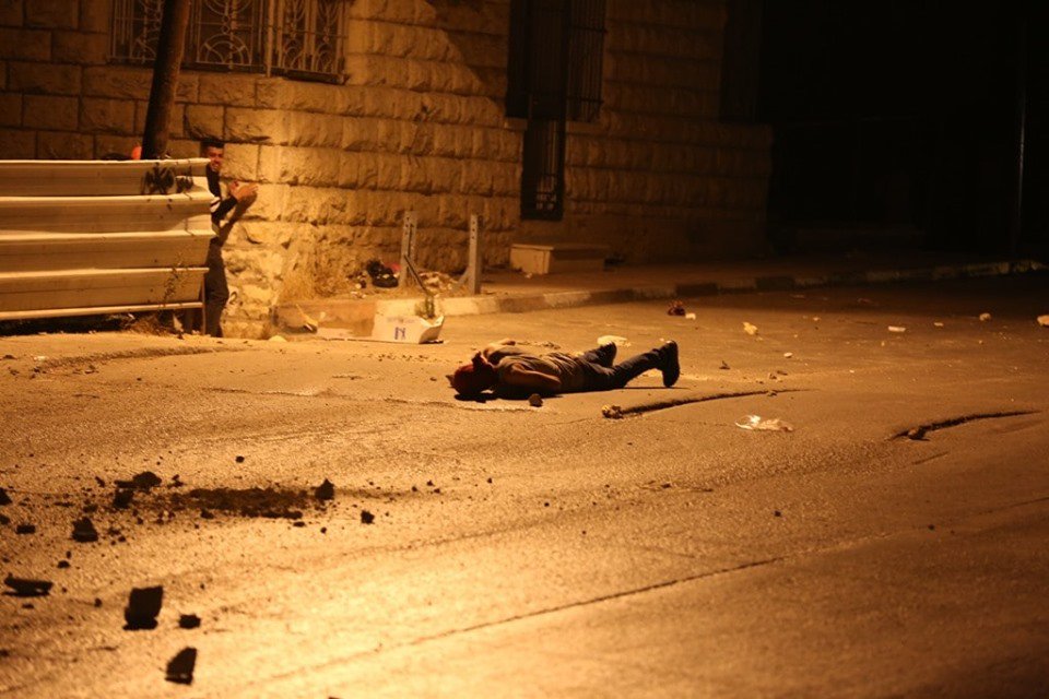 A confrontation between rioters and Israeli troops in Halhul city
