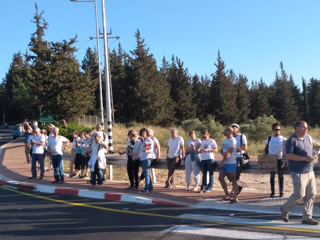 A group of Israelis and Palestinians (with Israeli citizenship) at Misgav/ Akko City Junction, North Israel, are currently protesting continues violence