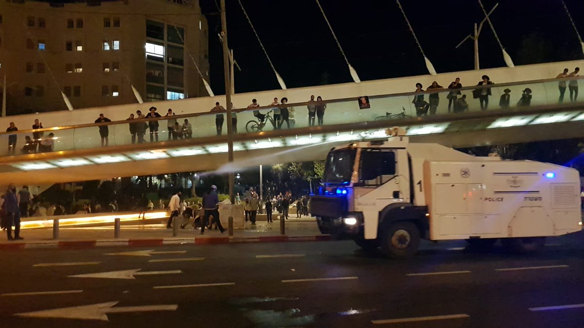 A police officer was lightly hurt by stones thrown by ultra-nationalists demonstrating near the entrance of Jerusalem over the death of Ahuvia Sandak, a hilltop youth killed during a police chase last year. 10 suspects have been arrested so far