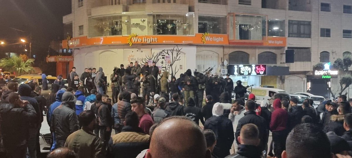 A group of Palestinians including armed individuals are currently demonstrating in front of Al Am'ari Refugee Camp in Ramallah City in solidarity with a sick Palestinian prisoner in Israeli jails