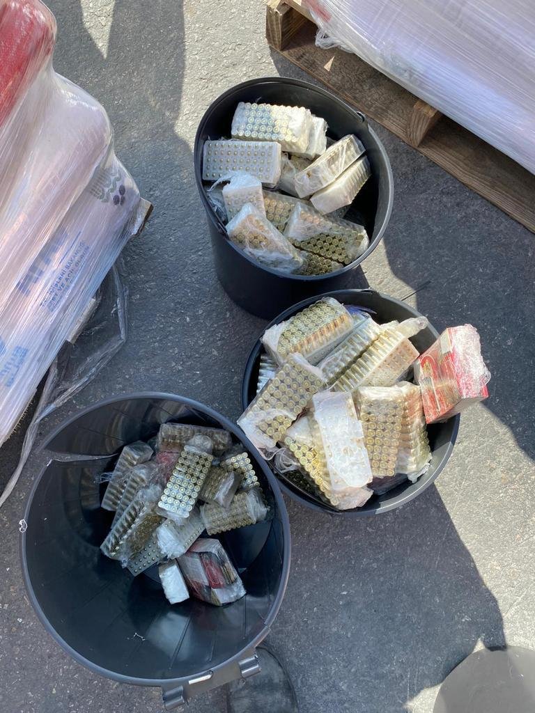 Defense Ministry says some 10,000 bullets en route to Gaza were seized at Kerem Shalom crossing, hidden in false bottoms of garbage cans