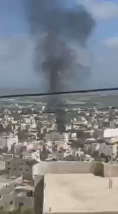 Smoke rising from Jenin, cause unknown. Gunfire exchange is reportedly continuing