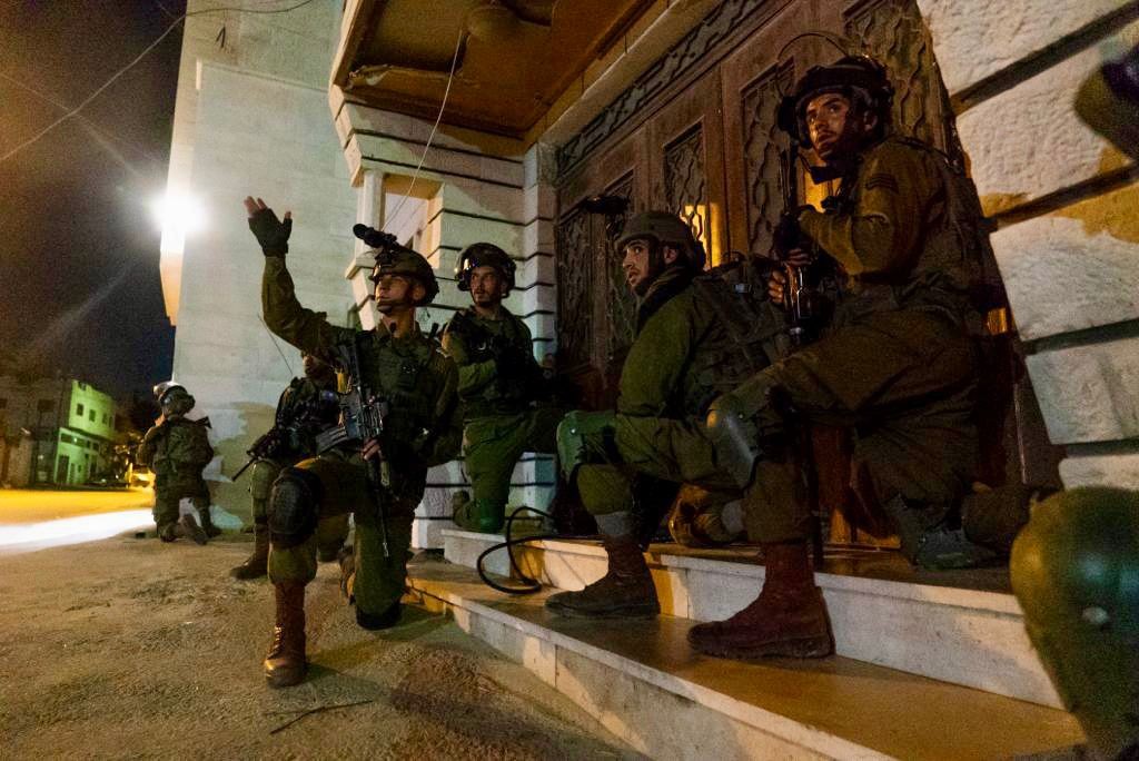 Israeli army says troops arrested 18 Palestinians suspected of involvement in terror activities during overnight raids in the West Bank