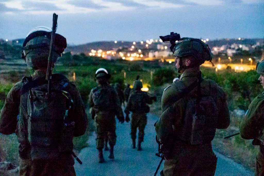 Israeli army says troops arrested 18 Palestinians suspected of involvement in terror activities during overnight raids in the West Bank