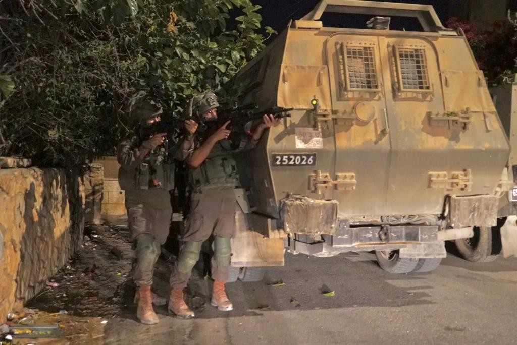 Israeli army says troops detained 18 wanted Palestinians during overnight raids in the West Bank; makeshift Carlo SMG seized by police near Hebron, ammunition and weapon parts seized in Qatanna