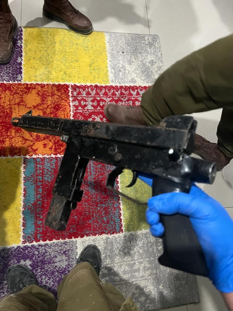 Israeli army says troops detained 18 wanted Palestinians during overnight raids in the West Bank; makeshift Carlo SMG seized by police near Hebron, ammunition and weapon parts seized in Qatanna