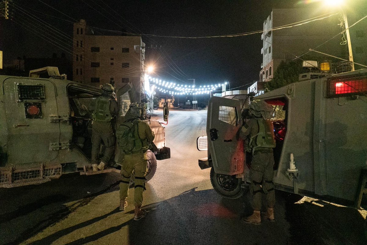 Israeli army says troops detained 17 wanted Palestinians during overnight raids across the West Bank; weapons seized; manhunt for 3rd Jordan Valley gunman continues; Palestinian media reports one killed in clashes near Jenin