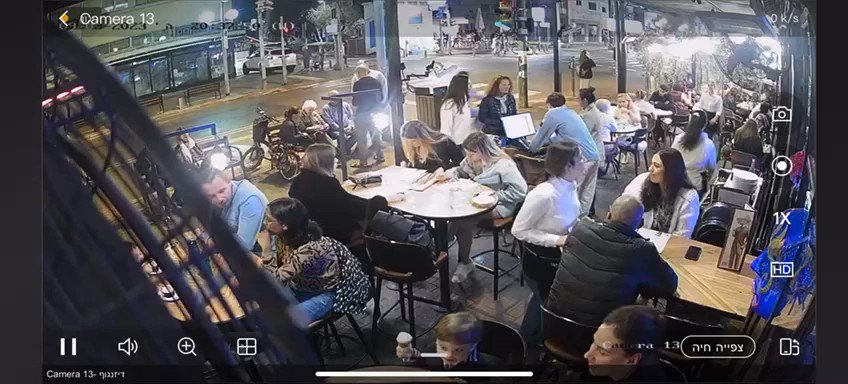 Surveillance camera footage shows the terror shooting attack in Tel Aviv this evening, outside a cafe on Dizengoff Street. Three wounded, including one critically