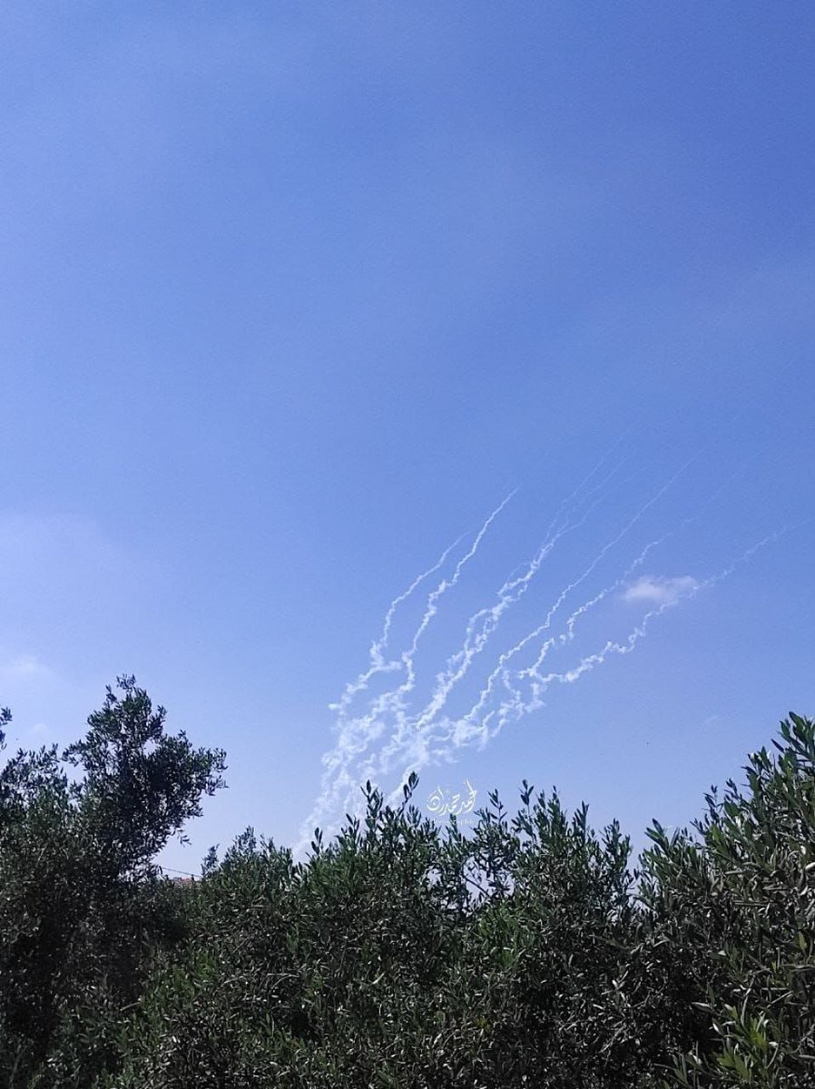 Photos of rocket fire and Iron Dome interceptions