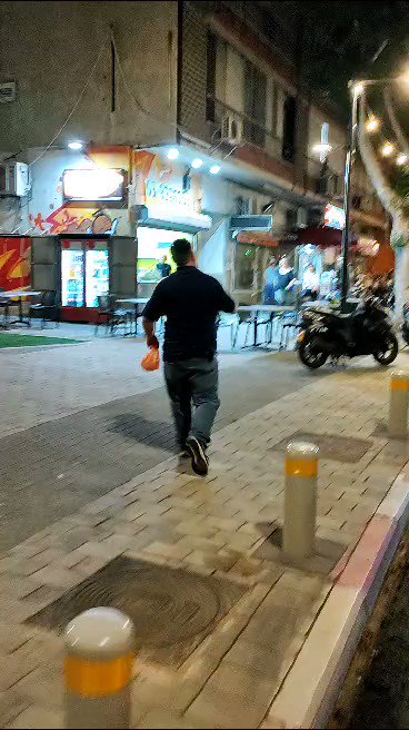 An armed passerby pulled out a gun and aimed it at anti-overhaul protesters tonight in Petah Tikva