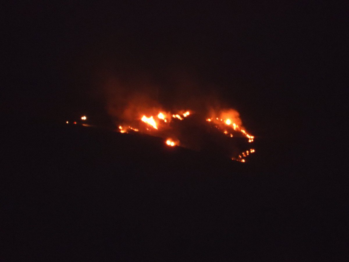 Israeli firefighting teams are trying to extinguish the fire that broke out in the foothills of the Golan opposite Lebanese territory after rockets fell on Israeli artillery positions in the area.