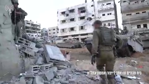 Israeli troops operating in the Gaza Strip have located a Hamas drone manufacturing plant and weapons depot within a residential building in Gaza City's Sheikh Radwan neighborhood, footage released by the Israeli army shows