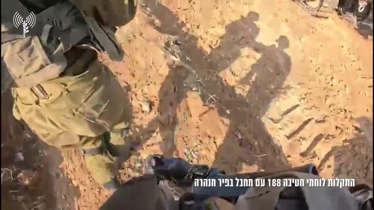 The Israeli army releases footage showing troops of the 188th Armored Brigade battling a Hamas gunman hiding in a tunnel shaft in Gaza City’s Shejaiya neighborhood. The helmet camera video shows soldiers surrounding the tunnel entrance, close to a school in Shejaiya, before a gunman opens fire from within. The troops are seen returning fire, with one of the soldiers dropping grenades inside