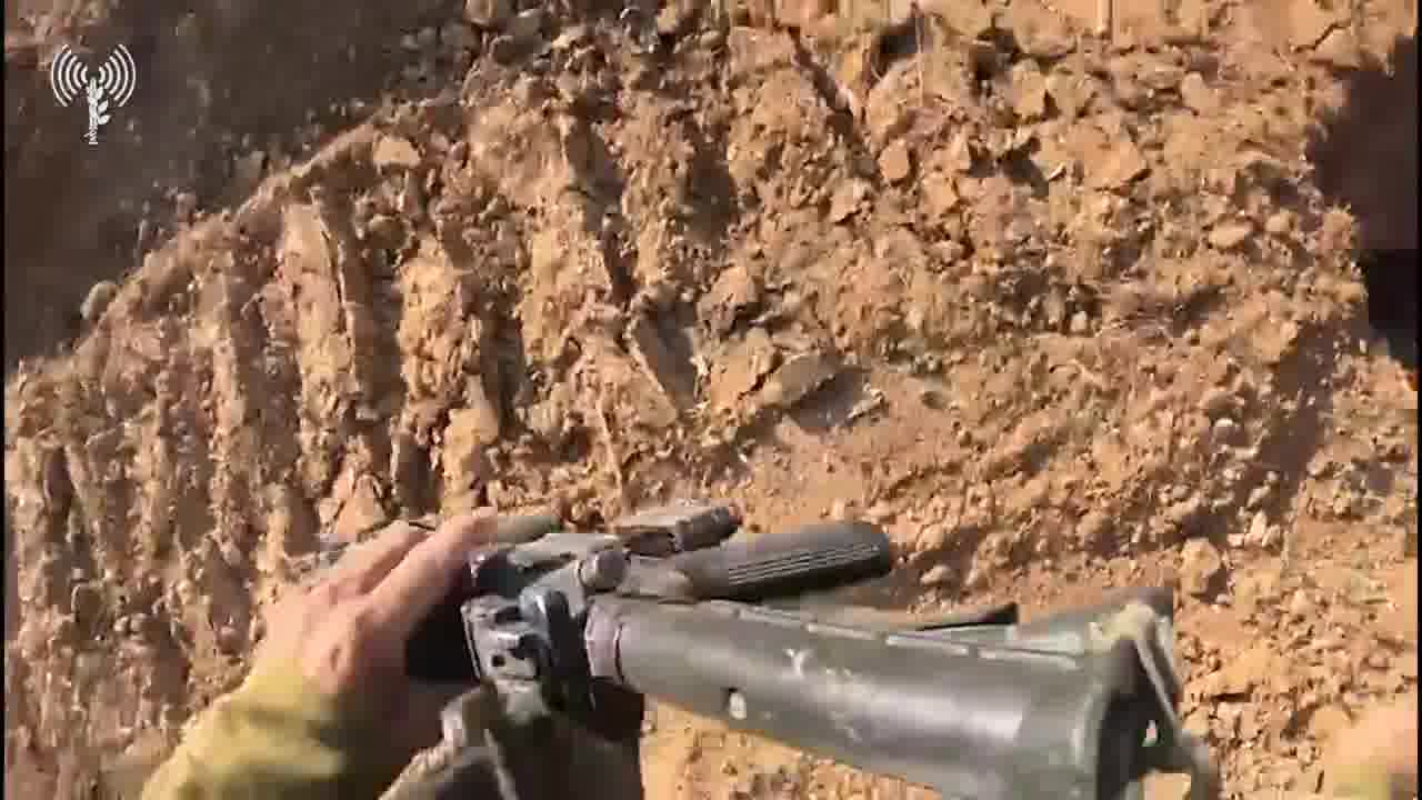 The Israeli army releases footage showing troops of the 188th Armored Brigade battling a Hamas gunman hiding in a tunnel shaft in Gaza City’s Shejaiya neighborhood. The helmet camera video shows soldiers surrounding the tunnel entrance, close to a school in Shejaiya, before a gunman opens fire from within. The troops are seen returning fire, with one of the soldiers dropping grenades inside