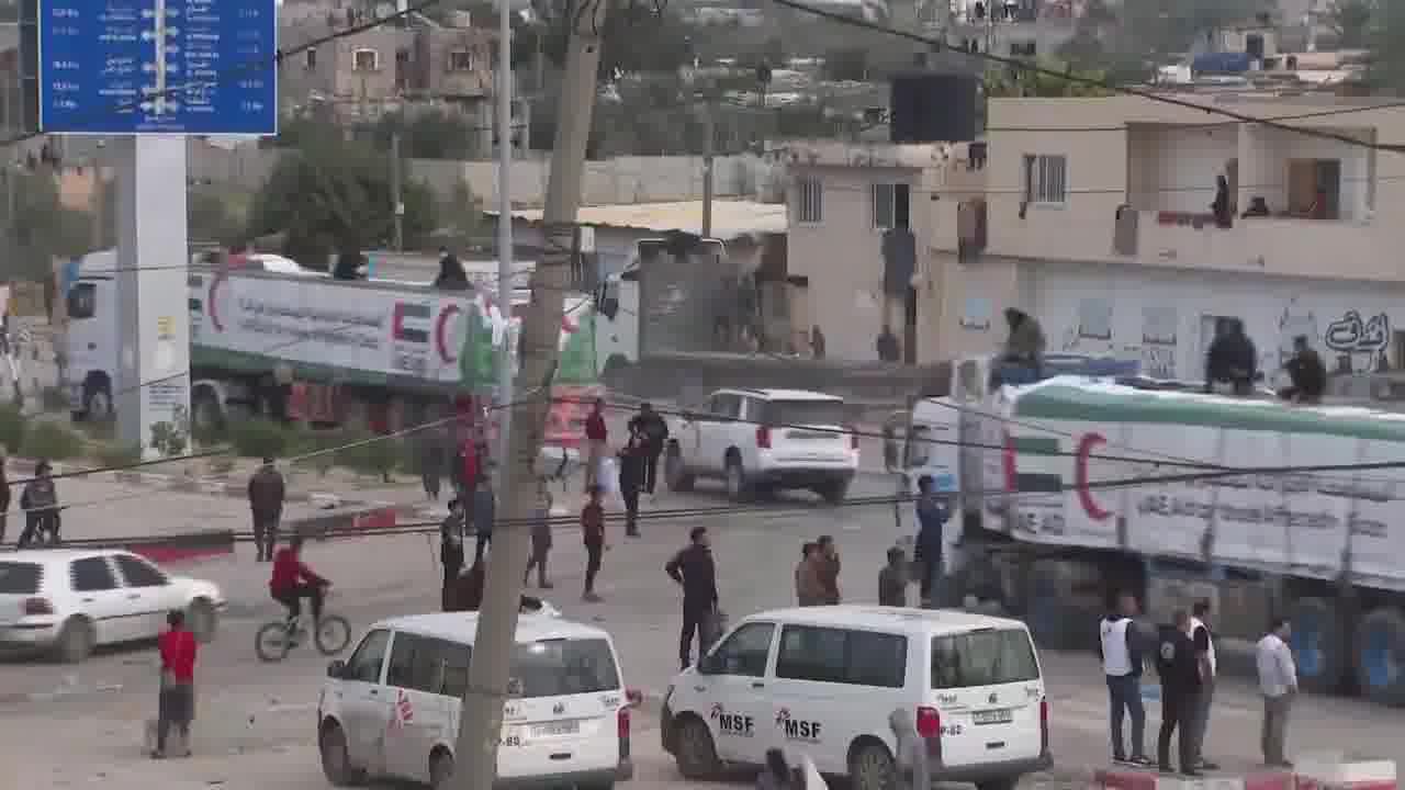 Aid trucks provided by the UAE guarded by what are likely members of Hamas police