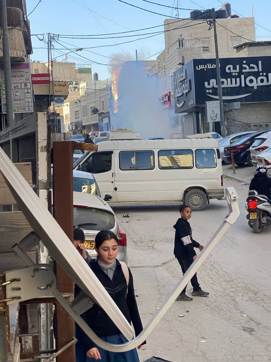 Israeli security forces storm Shuafat in Jerusalem and fire gas bombs as students return from their schools