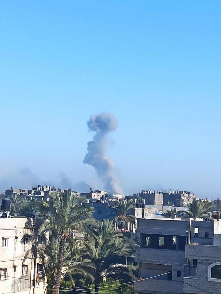 Plumes of smoke rise as a result of the occupation bombing of a residential square in the western areas of the city of Khan Yunis, south of the Gaza Strip.