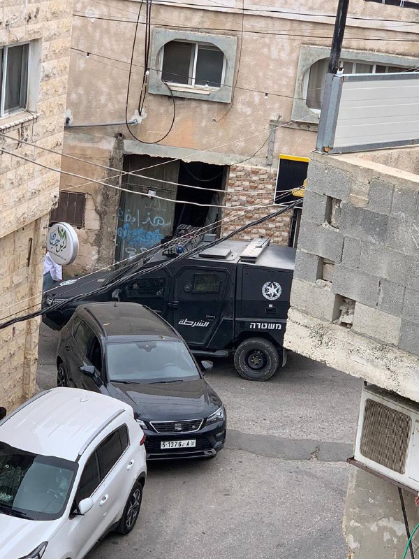 Israeli security forces storm a house in the town of Barta'a