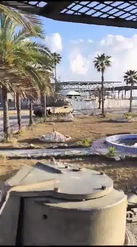 Israeli tank bulldozers Gaza sign as Israeli army captures Rafah crossing this morning