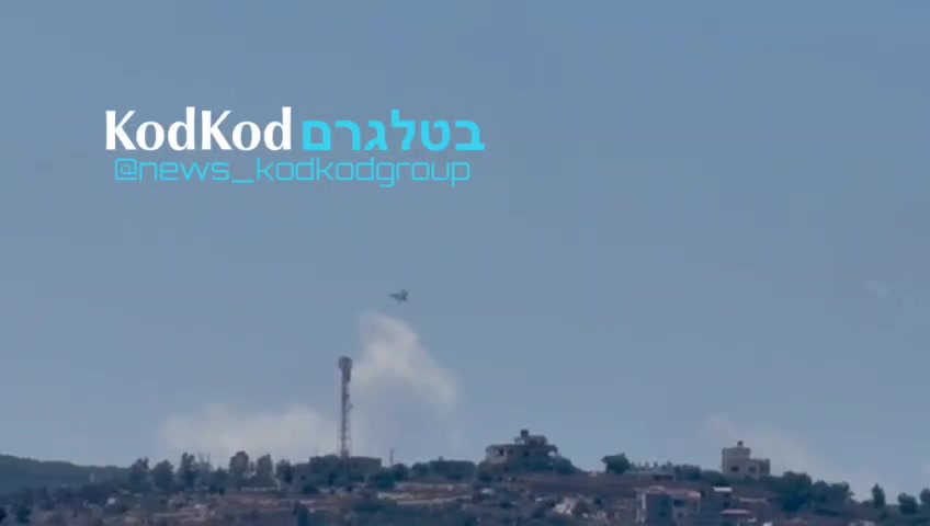 Fighter jets hover at a low altitude over the town of Aita al Shayab