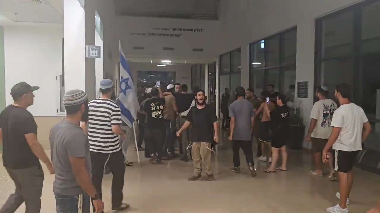 A right-wing mob has broken into the Israeli army's Beit Lid base where nine soldiers are being questioned over their alleged involvement in the abuse of a Palestinian detainee at the Sde Teiman detention facility