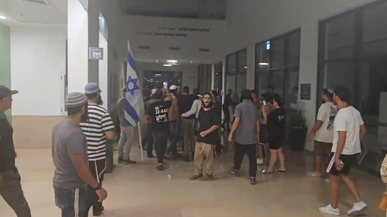 A right-wing mob has broken into the Israeli army's Beit Lid base where nine soldiers are being questioned over their alleged involvement in the abuse of a Palestinian detainee at the Sde Teiman detention facility