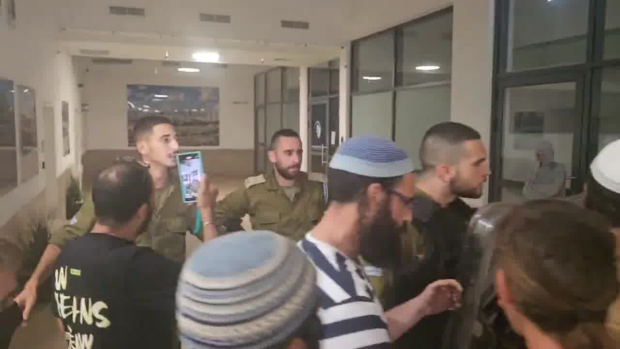 A right-wing mob has broken into the Israeli army's Beit Lid base where nine soldiers are being questioned over their alleged involvement in the abuse of a Palestinian detainee at the Sde Teiman detention facility