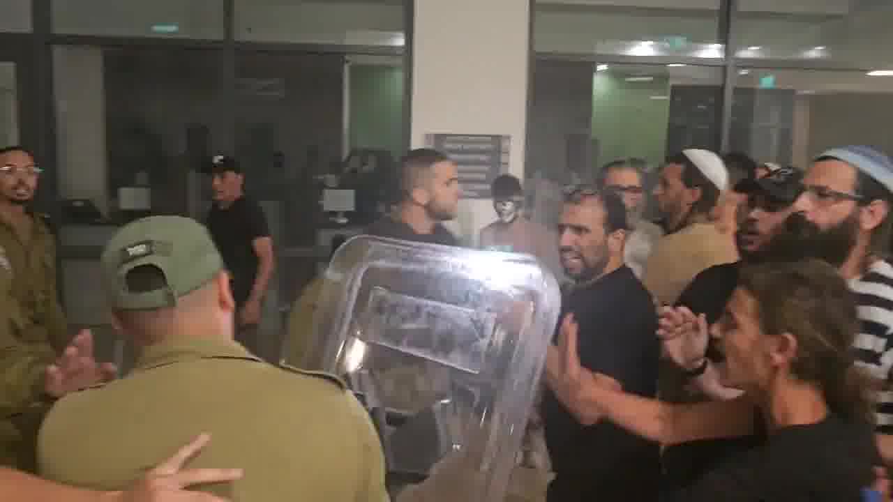 A right-wing mob has broken into the Israeli army's Beit Lid base where nine soldiers are being questioned over their alleged involvement in the abuse of a Palestinian detainee at the Sde Teiman detention facility