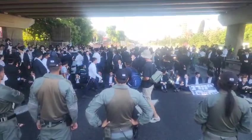 Dozens of ultra-Orthodox people block Highway 4 to the south near Bnei Brak, in protest of the conscription law. Photo: Shimon Baruch