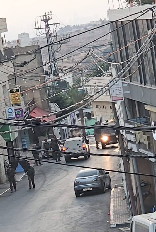 Soldiers storming the center of the town of Ni'lin, west of Ramallah.