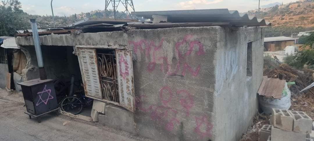 Jewish settlers burned a vehicle in a town near Hebron, and write hostile slogans on a house