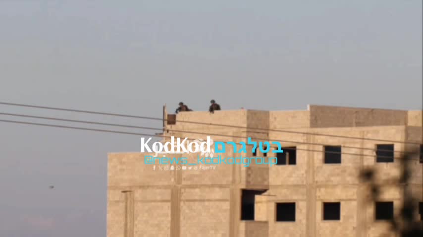 Snipers are deployed on the roofs of buildings near the cemetery in Kalkilia in order to protect the area.