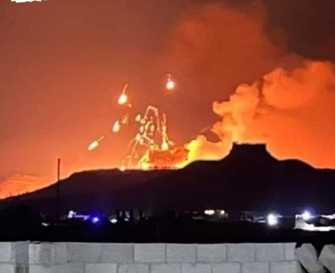 One of the Israeli air raids targeted the Karim warehouses northwest of the city of Salamiyah in the eastern Hama countryside. These warehouses house tank shells, artillery and missiles. The picture shows the Shammis Castle, Ain al-Zarqa Mountain and behind it the Karim warehouses that are exploding.