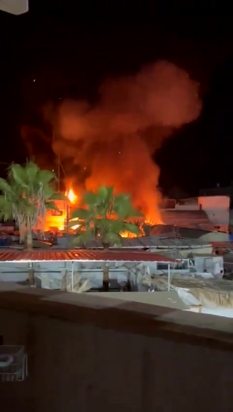 Video of the moments when planes bombed a tent sheltering displaced people in Al-Aqsa Martyrs Hospital in Deir al-Balah in the central Gaza Strip. The violent raid resulted in the deaths of 4 dead and a number of wounded.