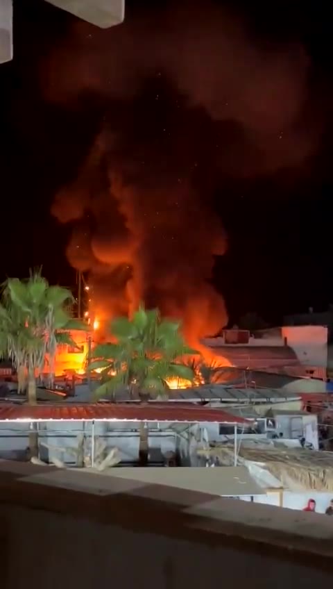 Video of the moments when planes bombed a tent sheltering displaced people in Al-Aqsa Martyrs Hospital in Deir al-Balah in the central Gaza Strip. The violent raid resulted in the deaths of 4 dead and a number of wounded.