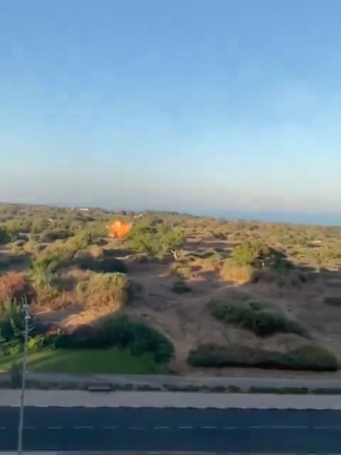 An explosive-laden drone impacted an open area in Ashkelon a short while ago, the Israeli army says and footage shows. The military does not yet detail where the drone was launched from. There are no reports of injuries