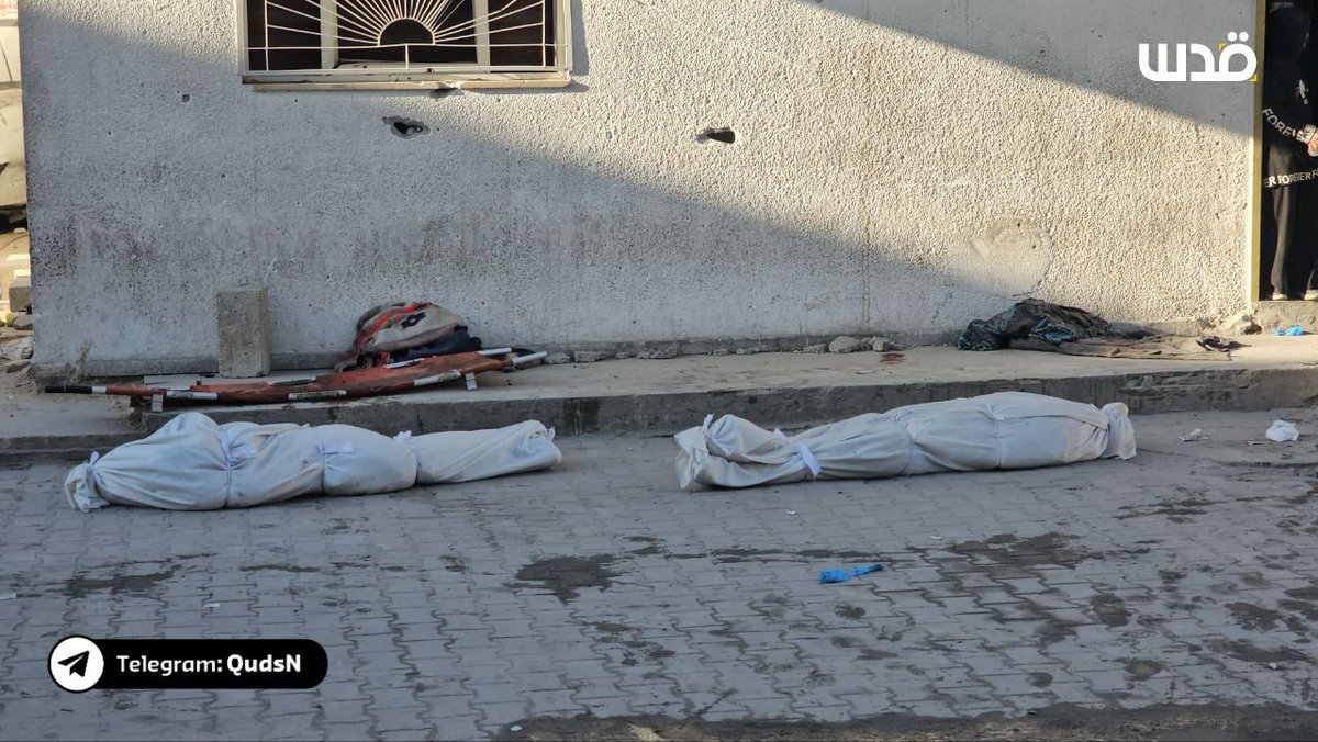 Recovering two dead as a result of shelling around Kamal Adwan Hospital in Beit Lahia Project, north of the Gaza Strip