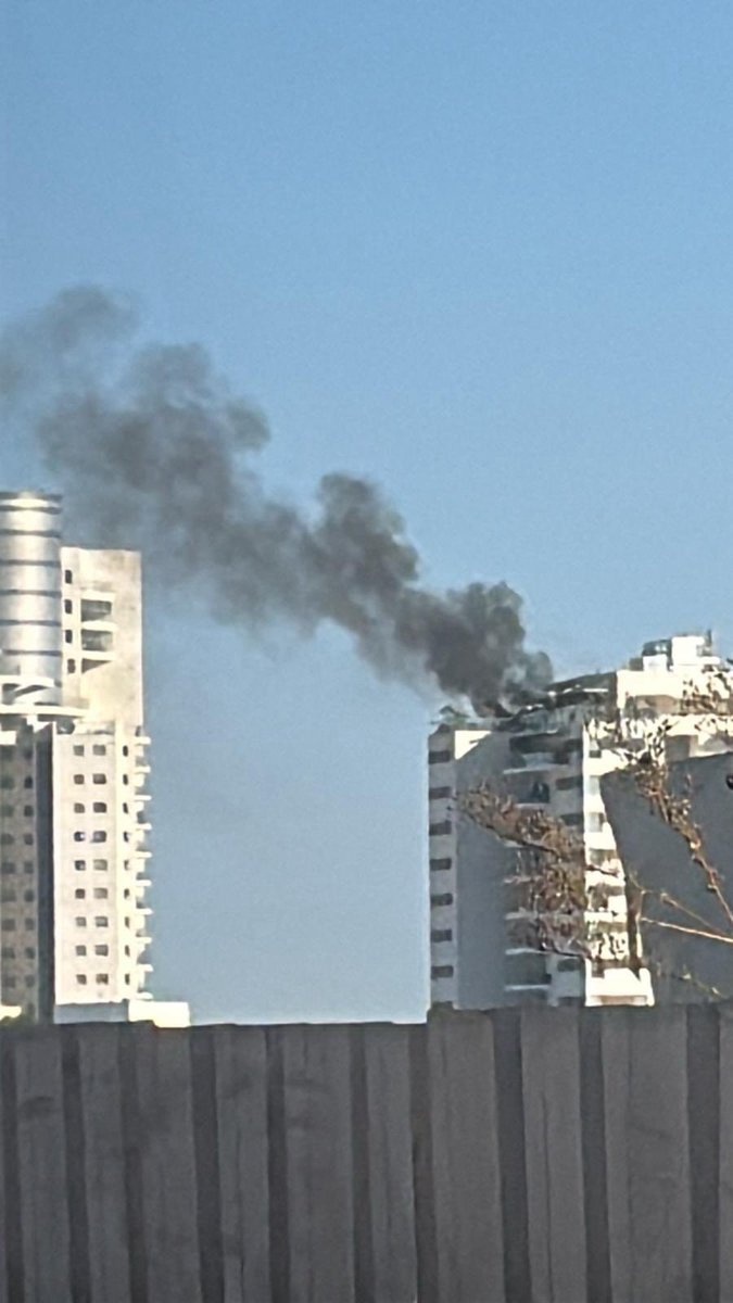 A Drone has reportedly struck a High-Rise Residential Building in the City of Yavne, to the South of Tel Aviv in Central Israel. There were not any Alerts prior to the Impact, and it is not known who launched the Drone