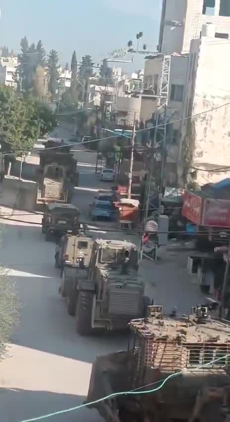 Palestinian media report clashes between Israeli forces and local militants in the West Bank's Tulkarm, amid circulating footage of robust deployment of Israeli army troops in the area. Reports of Israeli forces besieging the Tulkarm camp and heavy machinery demolishing infrastructure