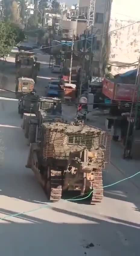 Palestinian media report clashes between Israeli forces and local militants in the West Bank's Tulkarm, amid circulating footage of robust deployment of Israeli army troops in the area. Reports of Israeli forces besieging the Tulkarm camp and heavy machinery demolishing infrastructure