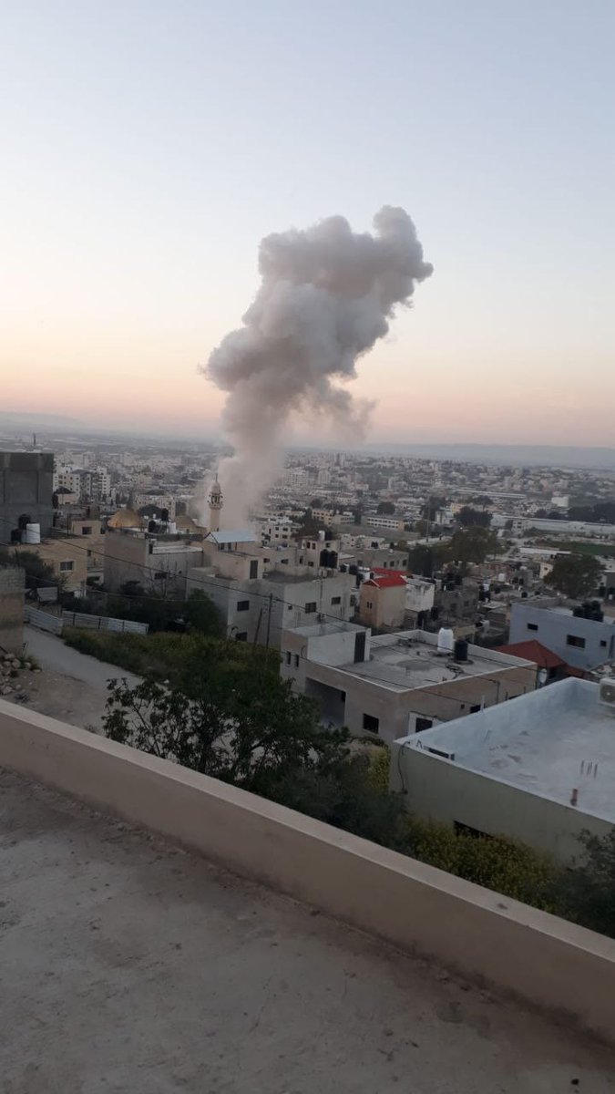 Columns of smoke rise after an airstrike targeted the vicinity of Khalid bin al-Walid Mosque, inside the eastern neighborhood of Jenin.