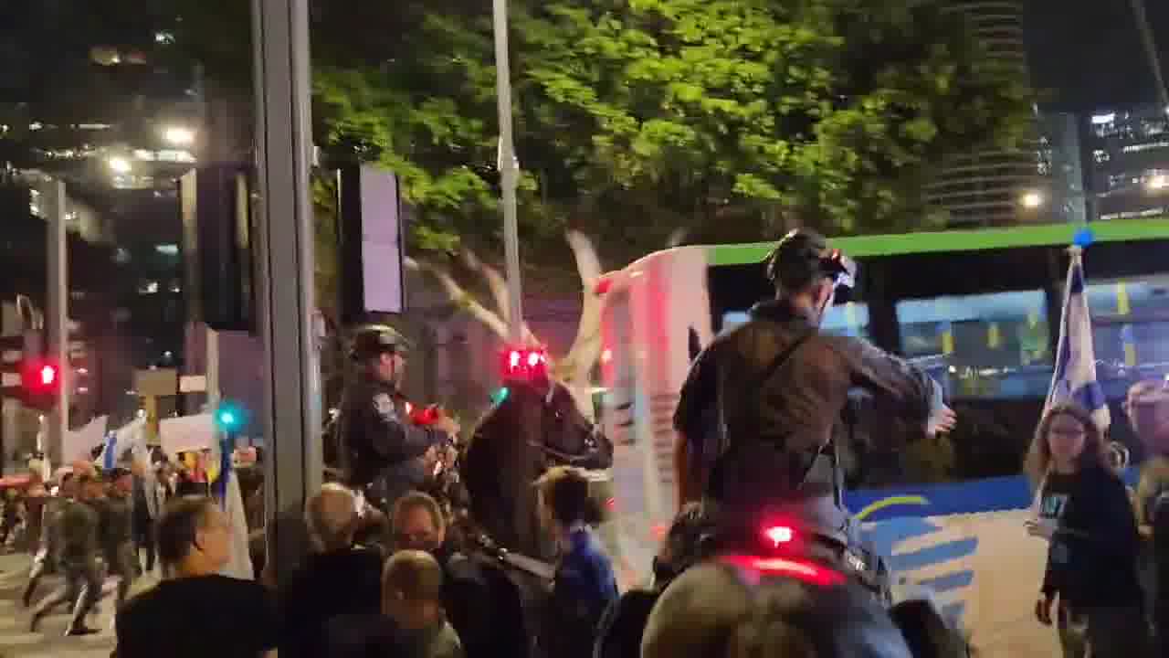 A march that left the Habima demonstration toward Ayalon was stopped on Begin Road by police and horsemen. Two protesters who were sitting on the road and refused to move were arrested. One of the horsemen whipped Haaretz photographer Itai Ron with the reins, in the footage wearing a white shirt and hat. Photo: Yair Palti