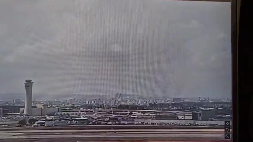 The moment a ballistic missile launched by Yemeni Houthis hit an area very close to Israel's Ben Gurion airport this morning