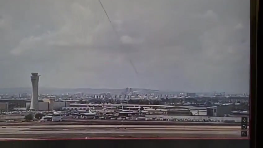 The moment a ballistic missile launched by Yemeni Houthis hit an area very close to Israel's Ben Gurion airport this morning