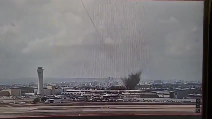 The moment a ballistic missile launched by Yemeni Houthis hit an area very close to Israel's Ben Gurion airport this morning