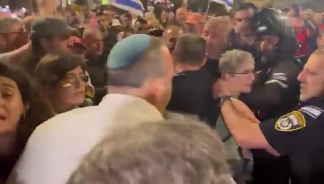 At the Tel Aviv rally, Israel Police officers attempt to remove anti-war protesters with violence, only to be confronted by Labor's @KarivGilad