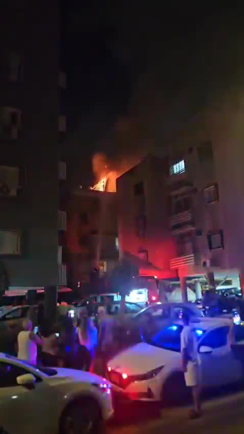 A fire broke out on the roof of a building in central Israel after debris from an interceptor fell during the latest Iranian missile attack