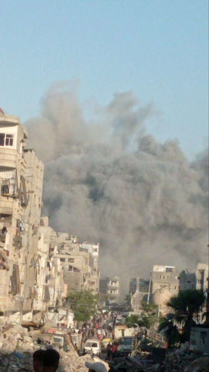 Airstrikes bomb a residential building east of Abu Iskandar Junction, north of Gaza City.