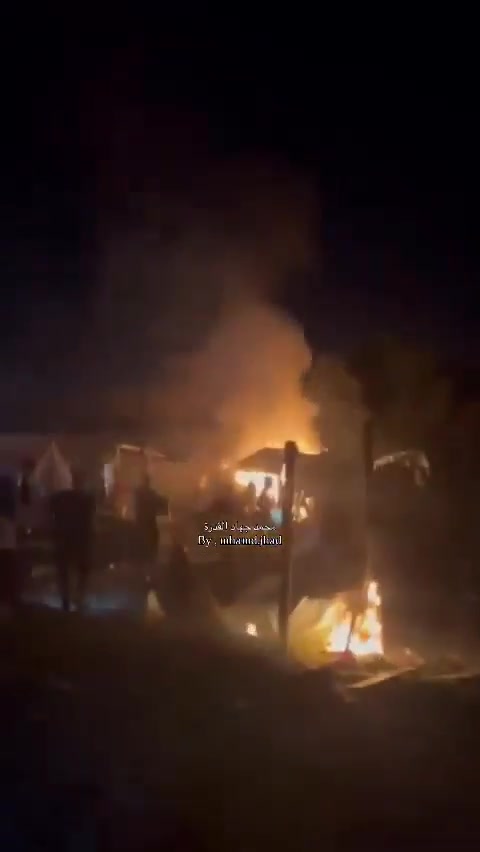 Fire breaks out in the tents of displaced people after they were bombed near Al-Ard Al-Tayyiba in Mawasi, Khan Yunis.