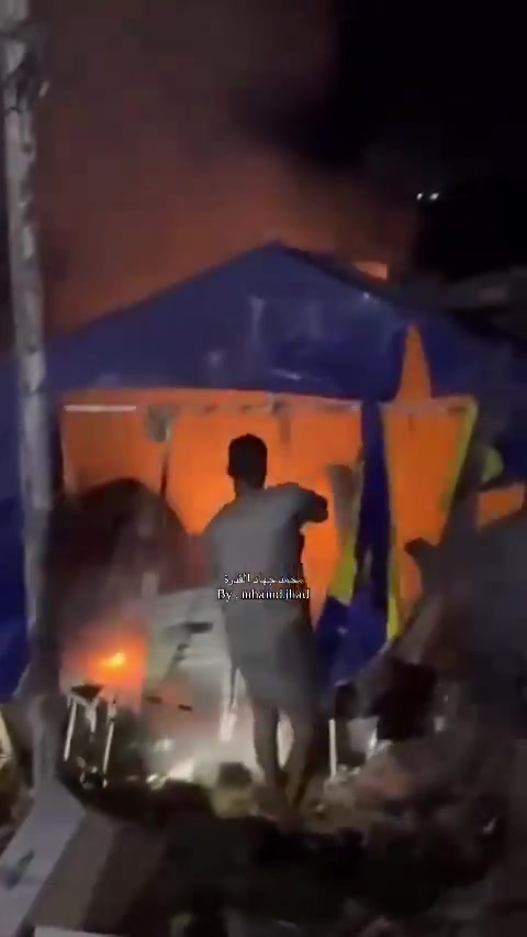 Fire breaks out in the tents of displaced people after they were bombed near Al-Ard Al-Tayyiba in Mawasi, Khan Yunis.
